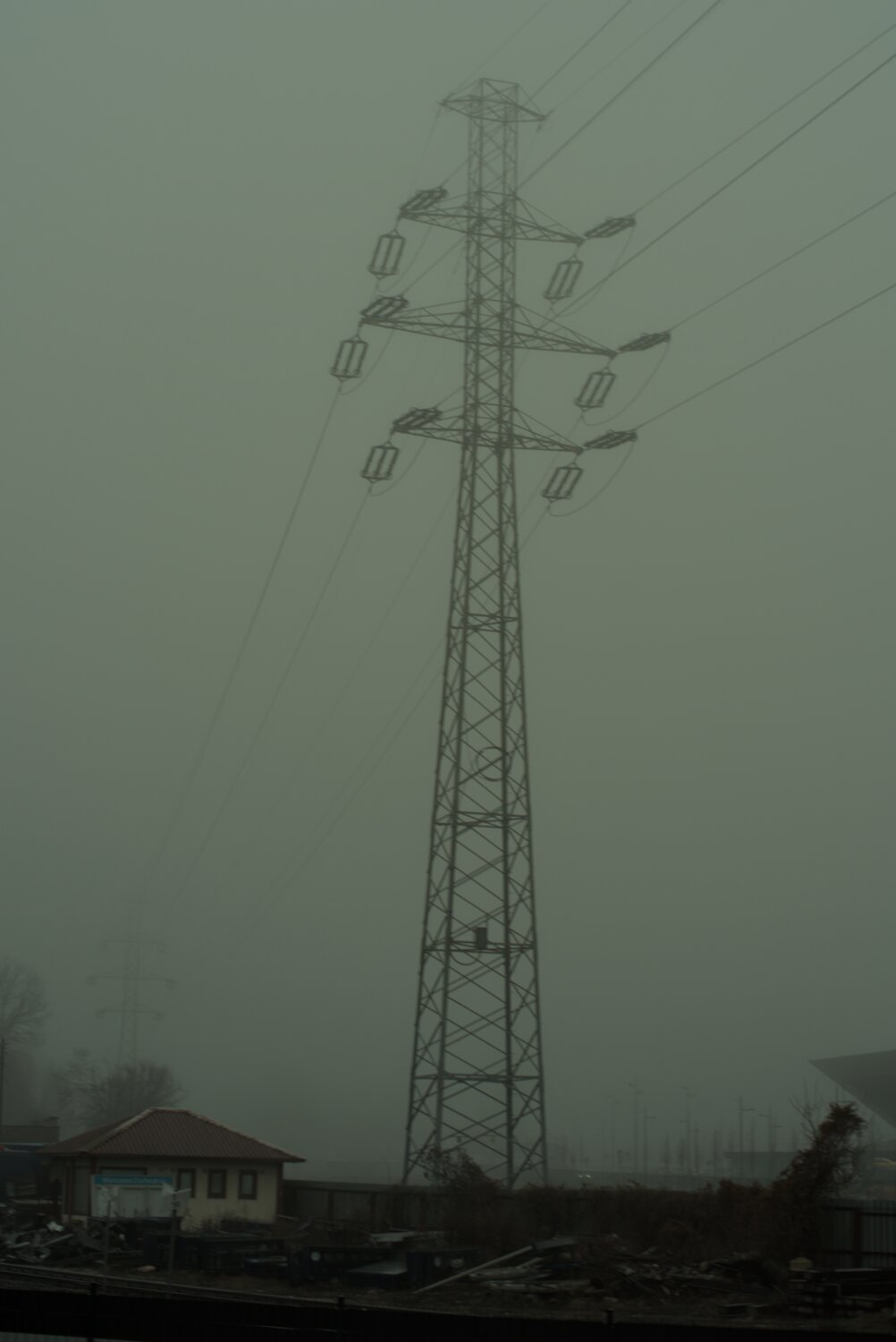 a power pole, shrouded among foggy skies, overall, very bleak feeling... a sign of the overall times, perhaps?