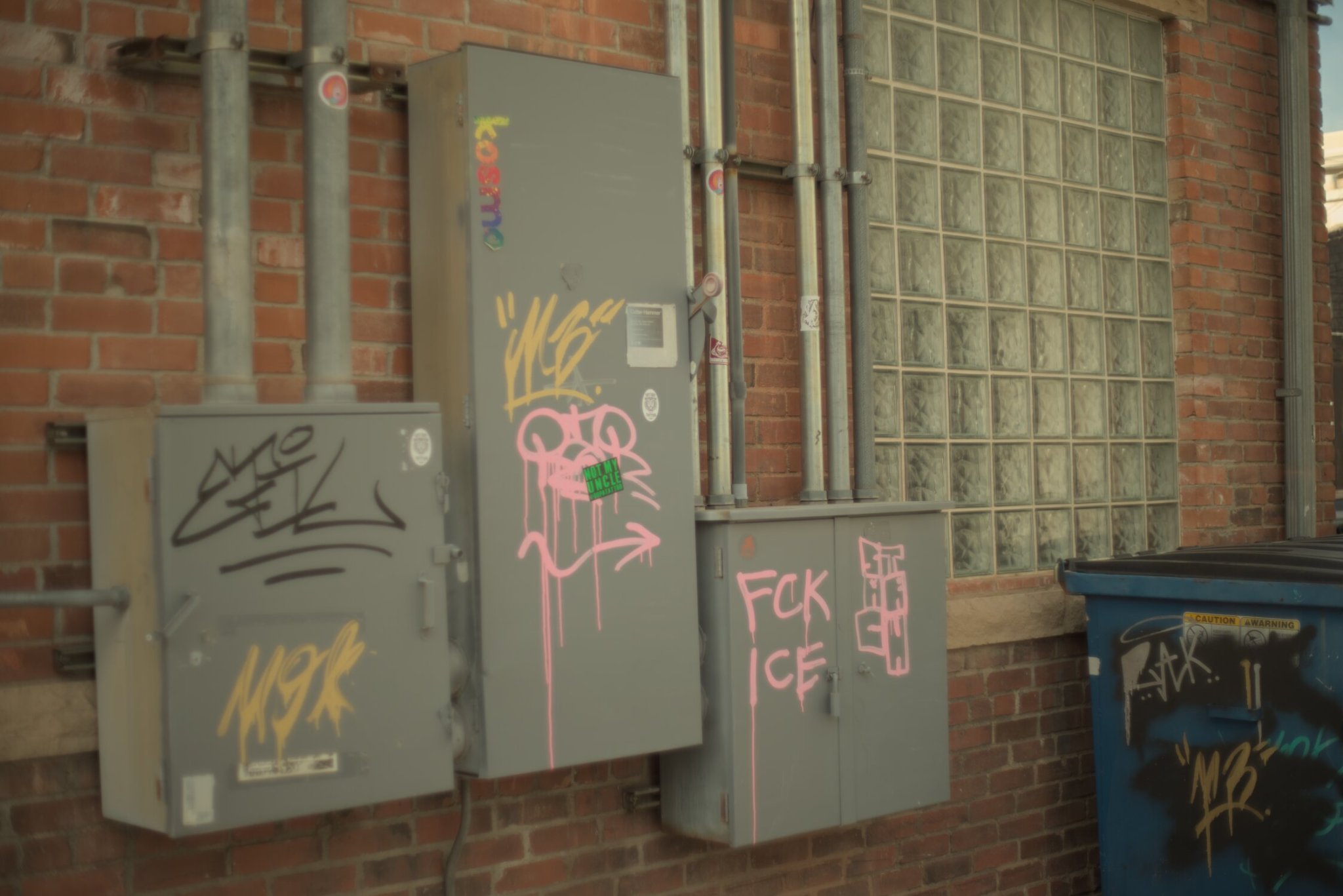 grafittied power boxes, notably some of the grafitti saying "FCK ICE"