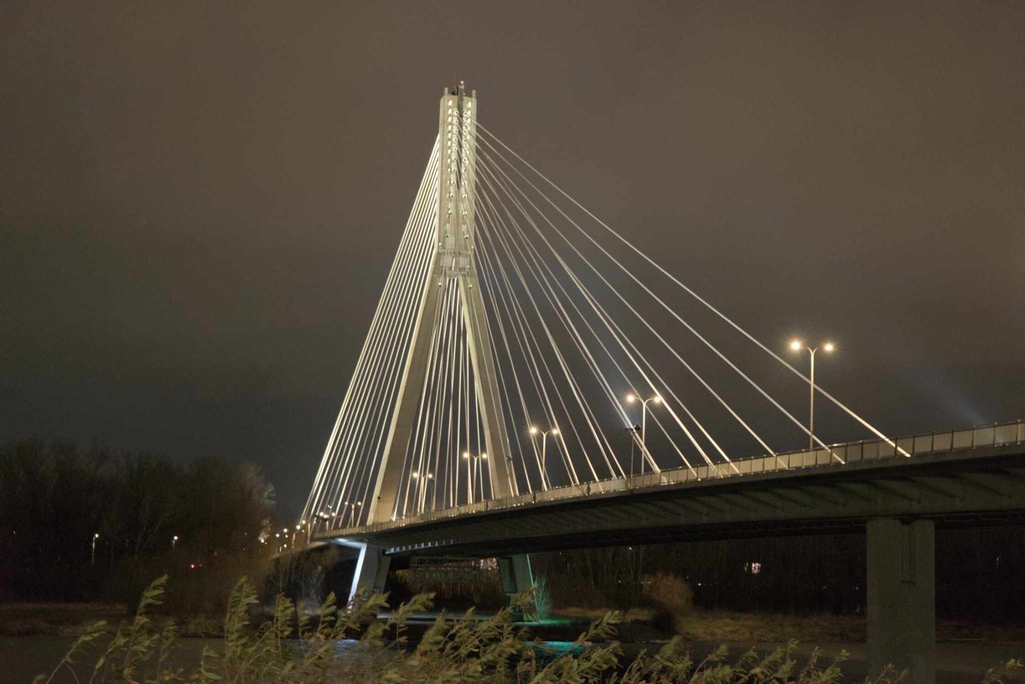 a suspension bridge, overilluminated as roadways tend to be...