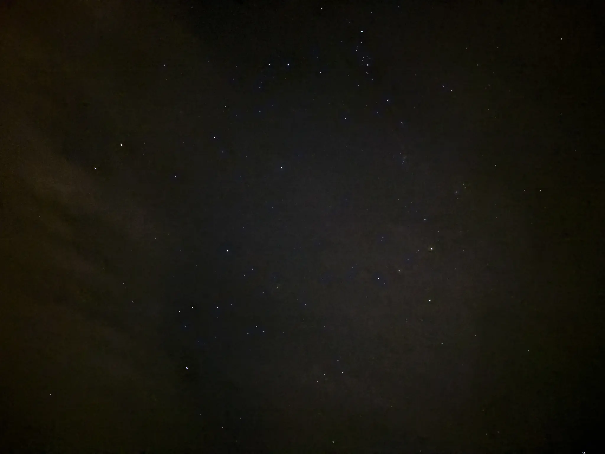 a somewhat grainy starfield, with faint clouds