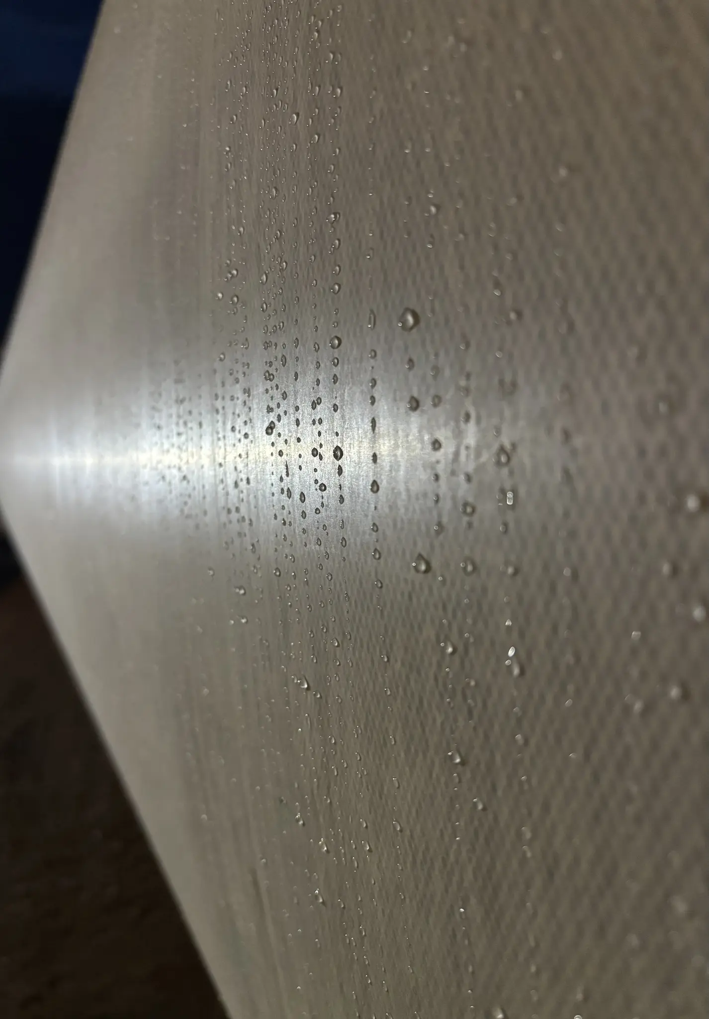 morning dew settled onto an unfinished blade's surface