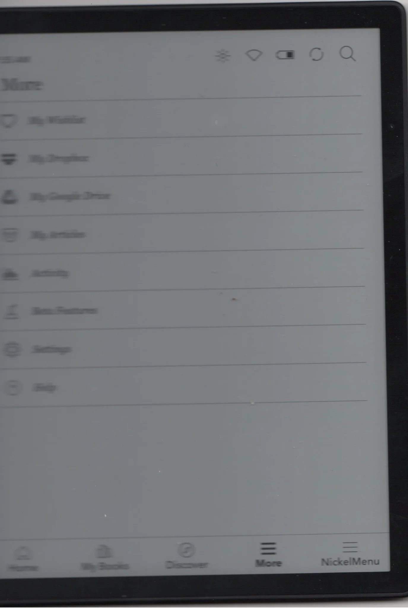 a rather blurry image of an e-reader display, towards the right it sharpens up and menu options "More" and "NickelMenu" are readable