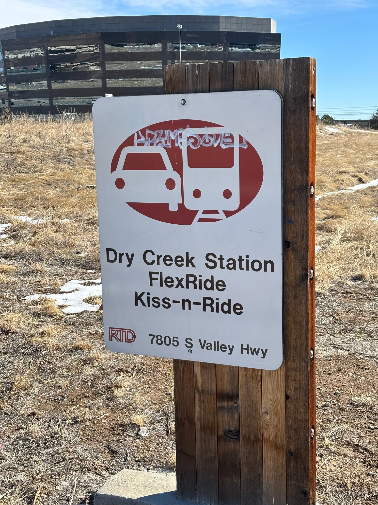 an rtd location sign that states: "dry creek station, flexride, kiss-n-ride"
