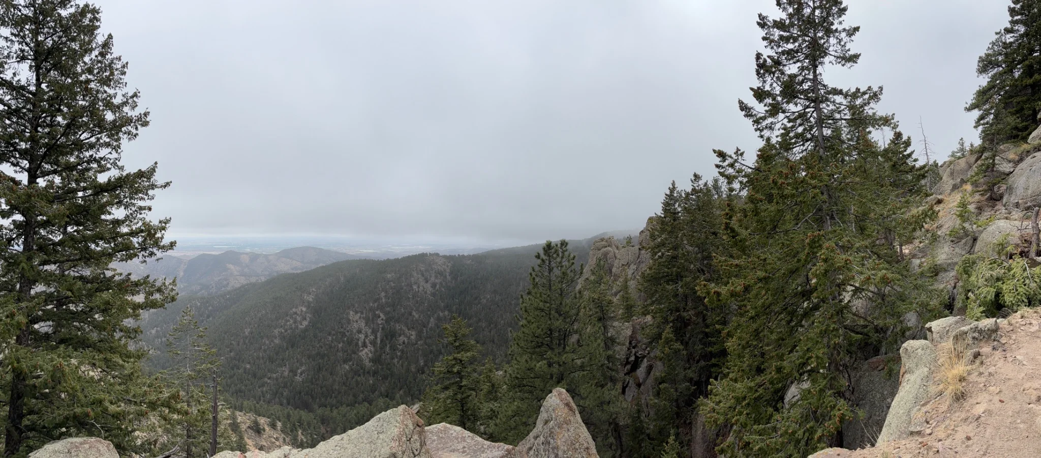 the cloudy valley beyond the mountain stretches to infinity 