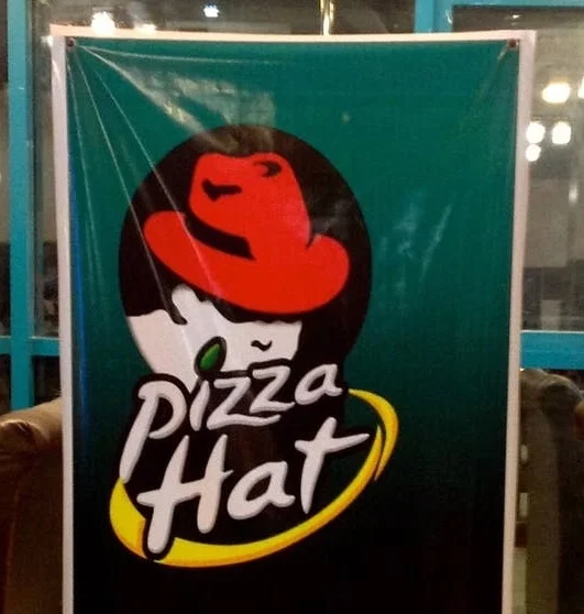 a "pizza hat" logo, the text looks quite similar to "pizza hut", but the pizza hut.. hut, has been replaced with the old redhat logo