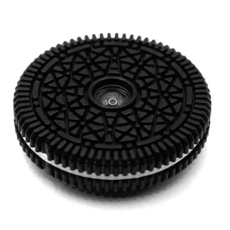 an oreo, with a disposable camera lens in the middle