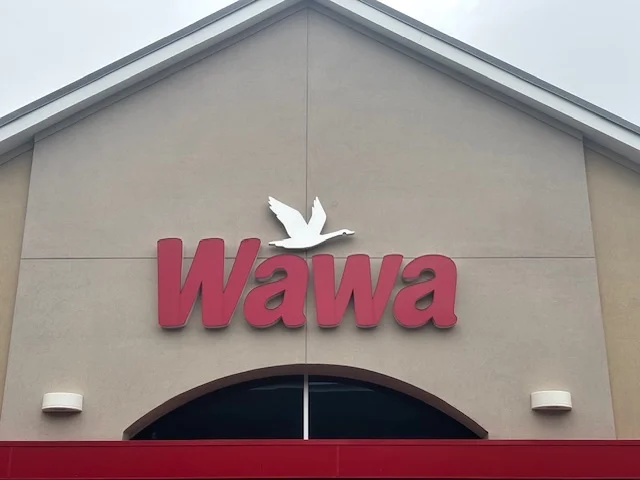 A picture of the sign for Wawa, an eastern united states gas station chain