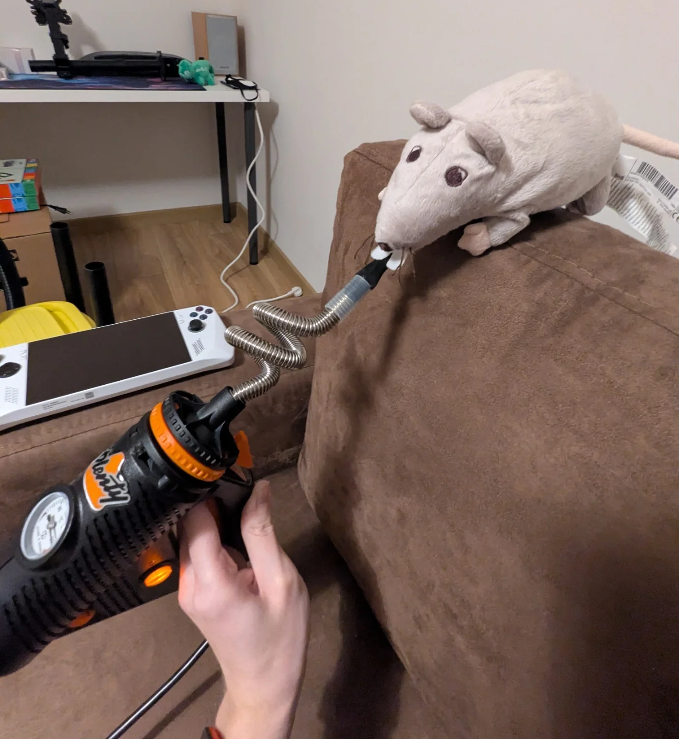 a rat plushie taking a hit out of a storz&bickel plenty vape