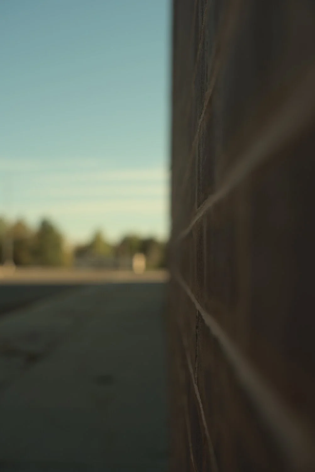 a very thin slice of in focus brick wall, looking out into the distance