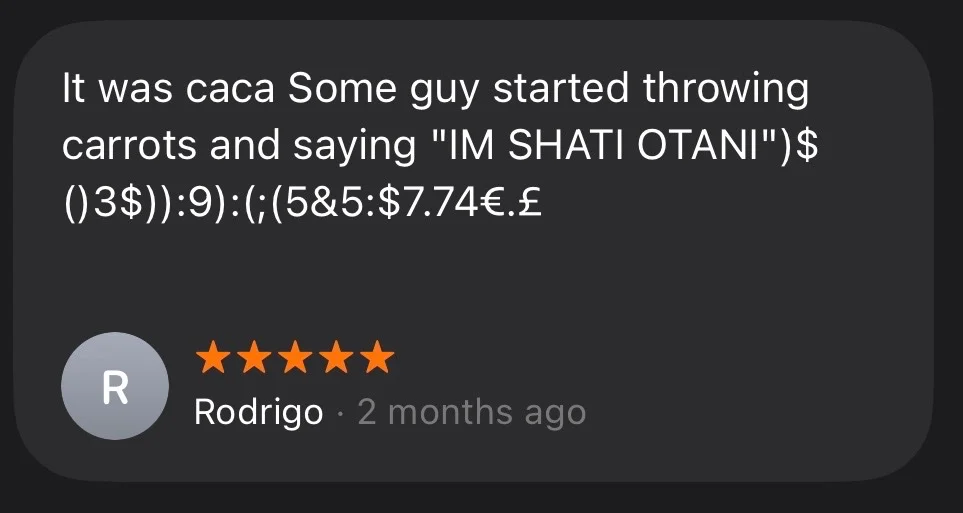 a five star apple maps review that says: 'It was caca Some guy started throwing carrots and saying "IM SHATI OTANI" (keysmashing)'