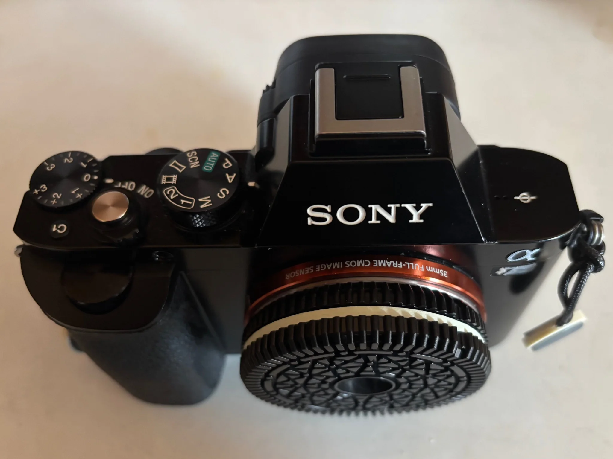a thin and light camera stackup, consisting of an oreo styled fixed focus prime barely thicker than a body cap and a sony a7r