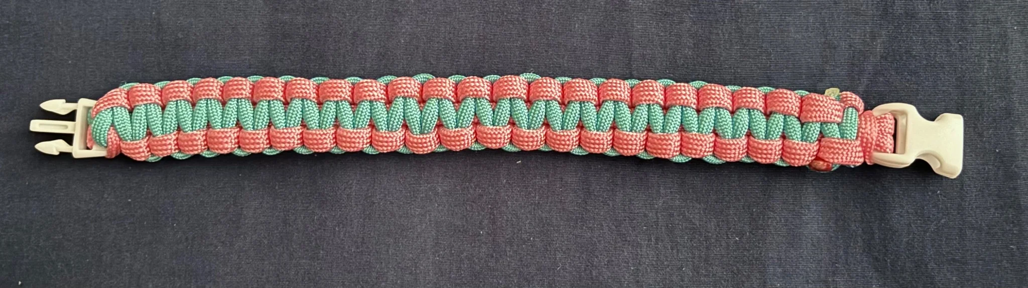 the same bracelet, this time splayed out, additionally from the last image, the white buckle is visible
