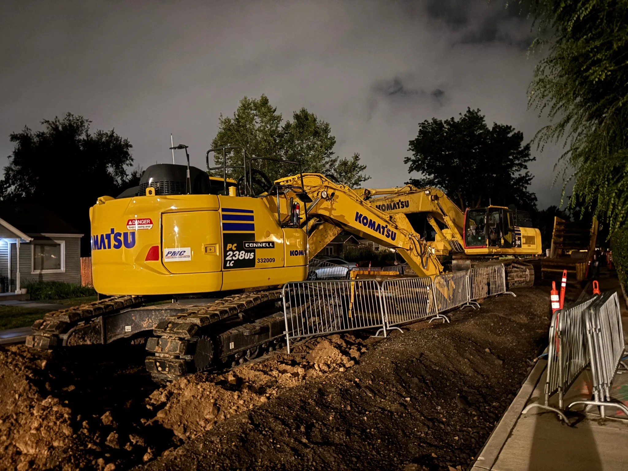 a couple of excavators, looking really rather new, sitting in the middle of a torn up road
again, long exposure made this shot look weird, almost double exposed